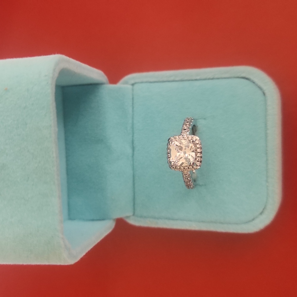 Cubic zirconia ring. Size 6 but adjustable.